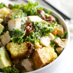Kale Caesar Salad with Chicken, Sun Dried Tomatoes, Avocado, and Cornbread Croutons