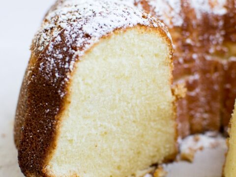 Fluffy vanilla pound cake with powdered sugar topping from Stuck On Sweet.