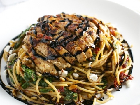 Grilled chicken over sun-dried tomato pasta, drizzled with balsamic glaze and topped with crumbled goat cheese. Perfect for dinner or lunch, flavorful and satisfying.