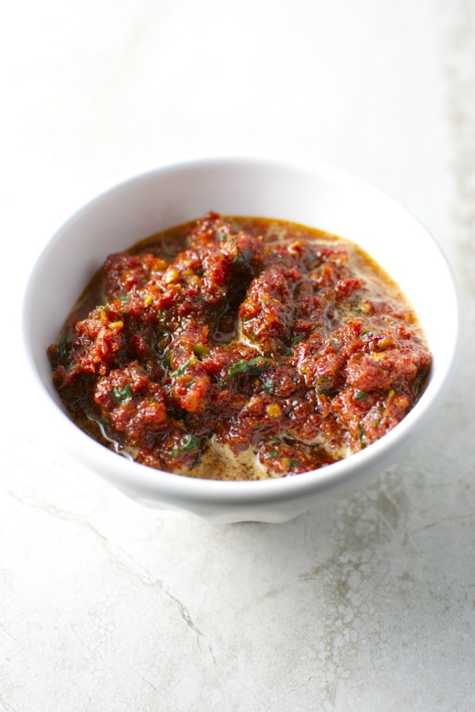 Savory meatball marinara in white bowl, close-up image of delicious Italian-style dish, homemade comfort food, perfect for dinner or family meal, Stuck On Sweet culinary recipe.