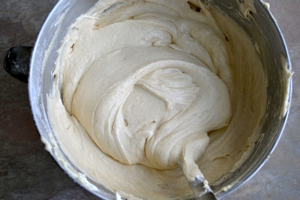 Creamy yellow cake batter in mixing bowl ready for baking, close-up of dessert preparation.