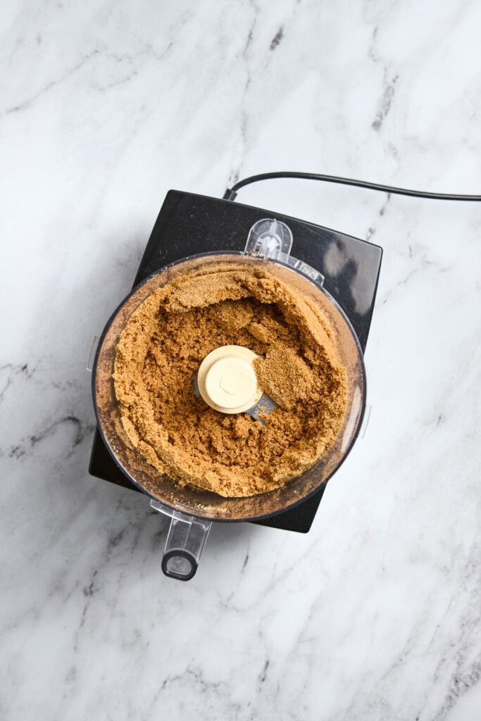 Sweetened brown sugar in a food processor, ready for baking or dessert recipes.