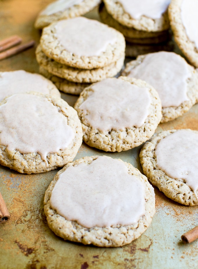 Butter cookies with white icing on top, freshly baked cookies, classic Christmas treat, soft and chewy sugar cookies, holiday dessert, homemade bakery goodies, sweet sugar cookies, vanilla flavored cookies, decorated cookies for holidays, Stuck On Sweet logo, sweet baked goods for celebration, cookie platter, festive cookie display, vanilla icing toppings.