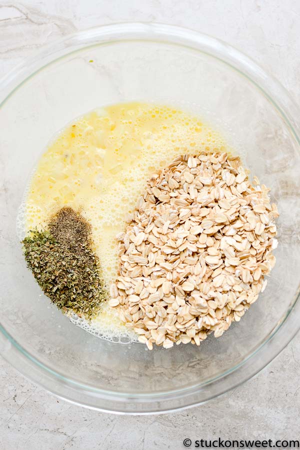 Creamy mixture with oats and herbs in a glass bowl for healthy snack recipes.