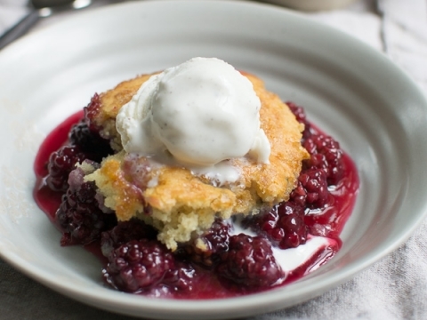 Buttered cobbler with fresh berry topping and vanilla ice cream, classic homemade dessert, warm fruit cobbler, delicious berry dessert, Stuck On Sweet recipe.