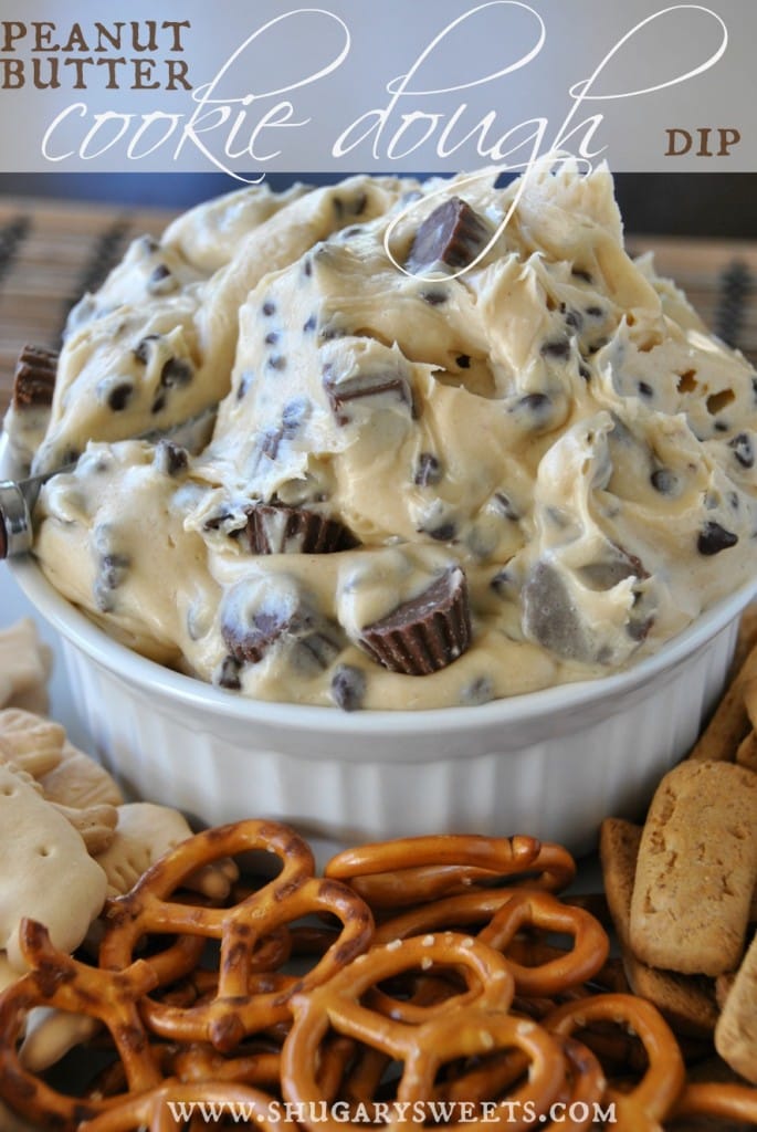 Rich peanut butter cookie dough dip with chocolate chips in a white bowl, served with pretzels and cookies for dessert. Perfect for sweet snack lovers and cookie dough fans.