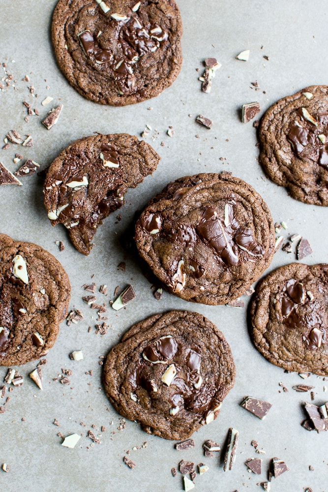 Rich chocolate chip cookies with white and dark chocolate chunks, freshly baked and on a baking sheet.