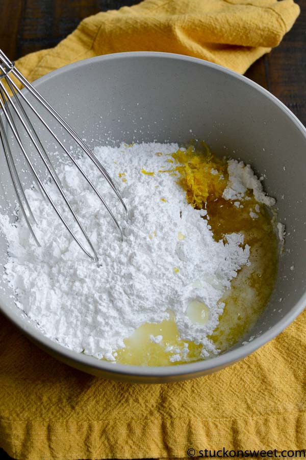 Flour, butter, and sugar in mixing bowl for baking recipes.