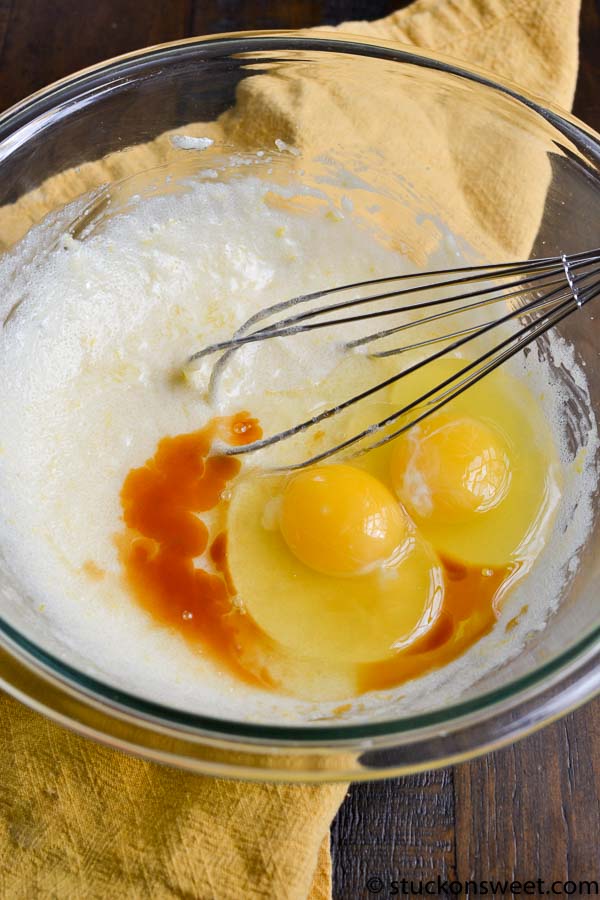 Beaten eggs with vanilla and caramel flavoring in a mixing bowl, ready for baking or cooking.