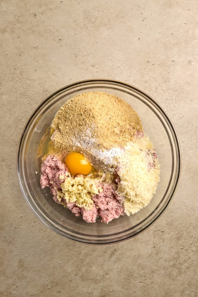 Cream cheese and ground beef mixture in a mixing bowl for sweet or savory recipes.