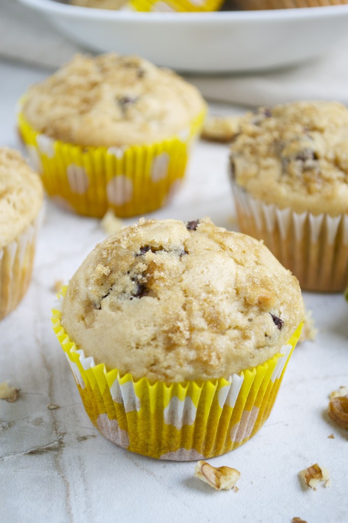 Soft and fluffy homemade chocolate chip muffins in yellow polka-dot paper liners, fresh out of the oven, perfect for breakfast or snack.