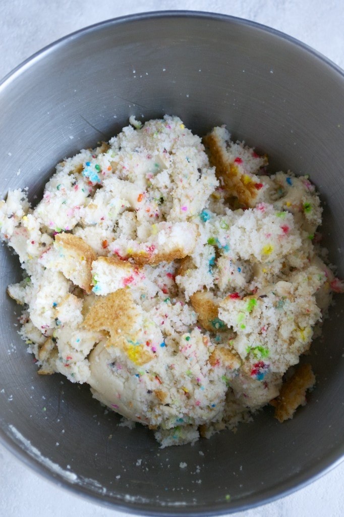 Colorful sprinkle cookie dough in a mixing bowl, ready to bake.
