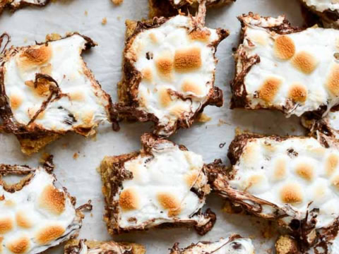 S'mores dessert bars cut up in white background