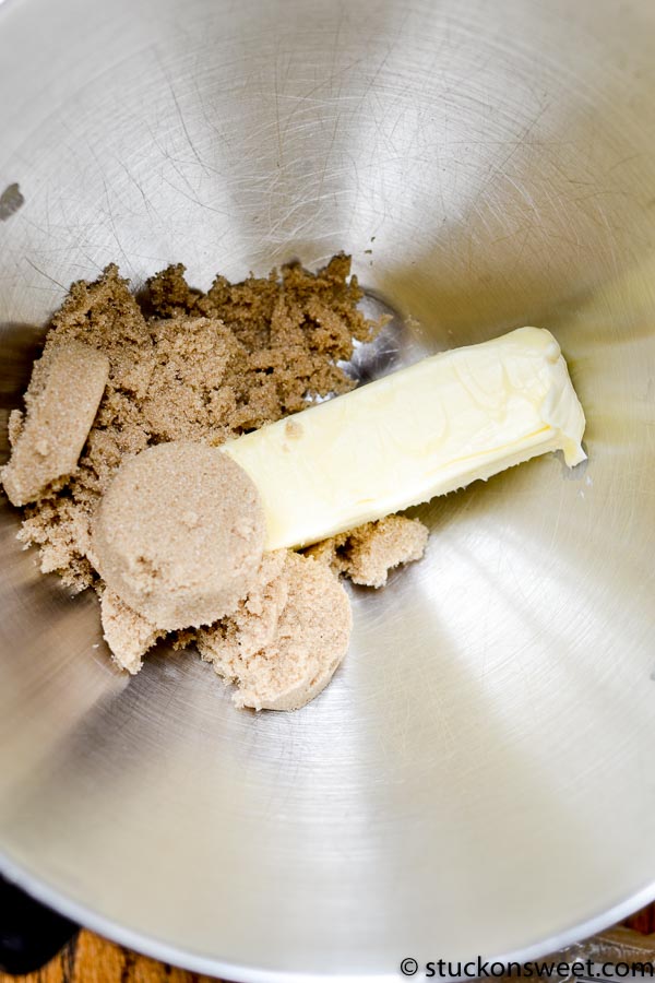 Cream cheese and brown sugar in mixing bowl for frosting recipe.