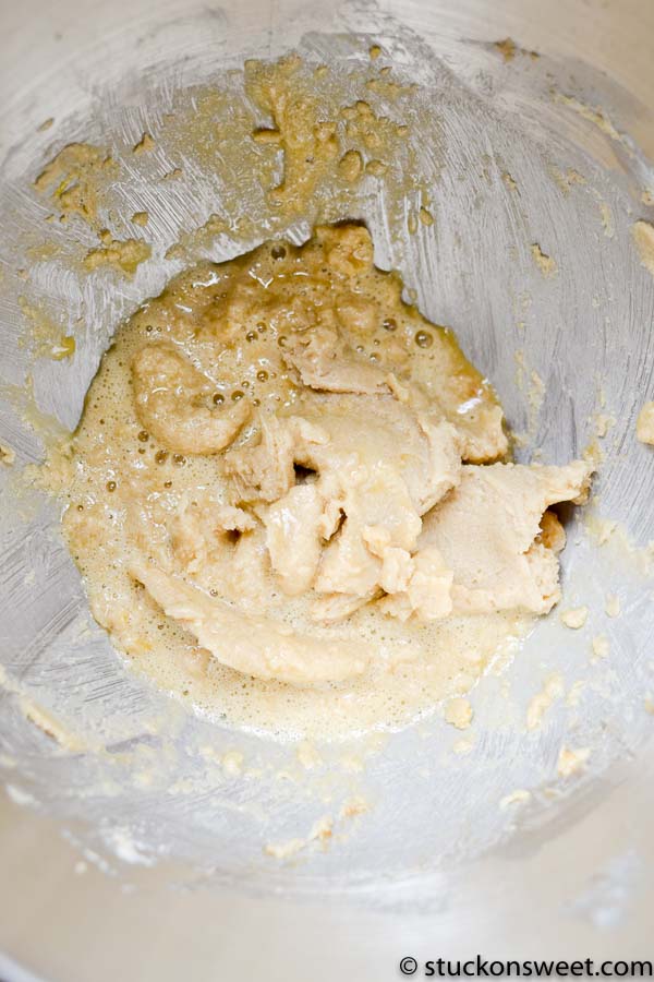 Creamy cookie dough mixture in mixing bowl for dessert recipes.