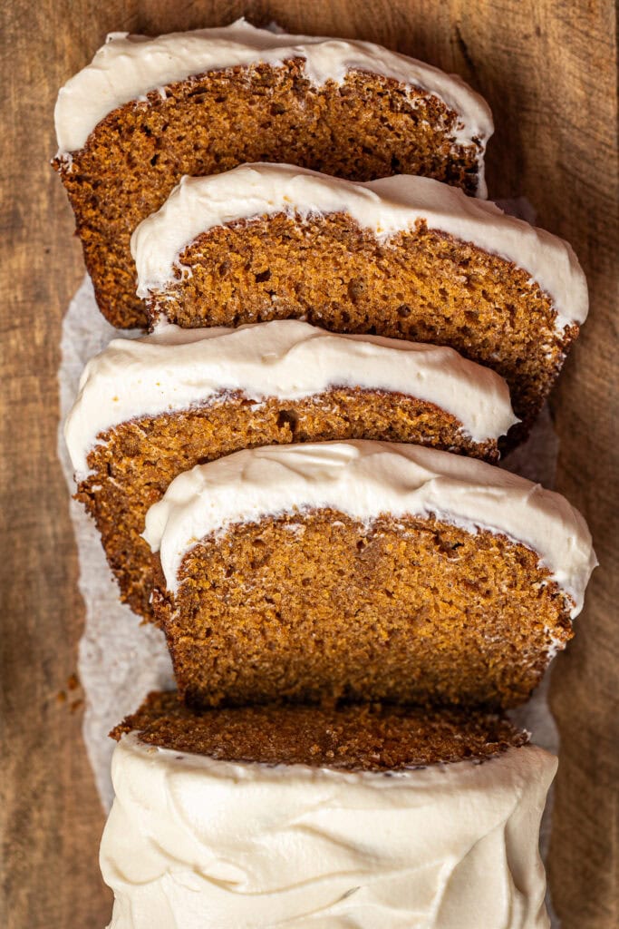 Delicious carrot cake slices with cream cheese frosting, close-up view, perfect for dessert or celebrations.