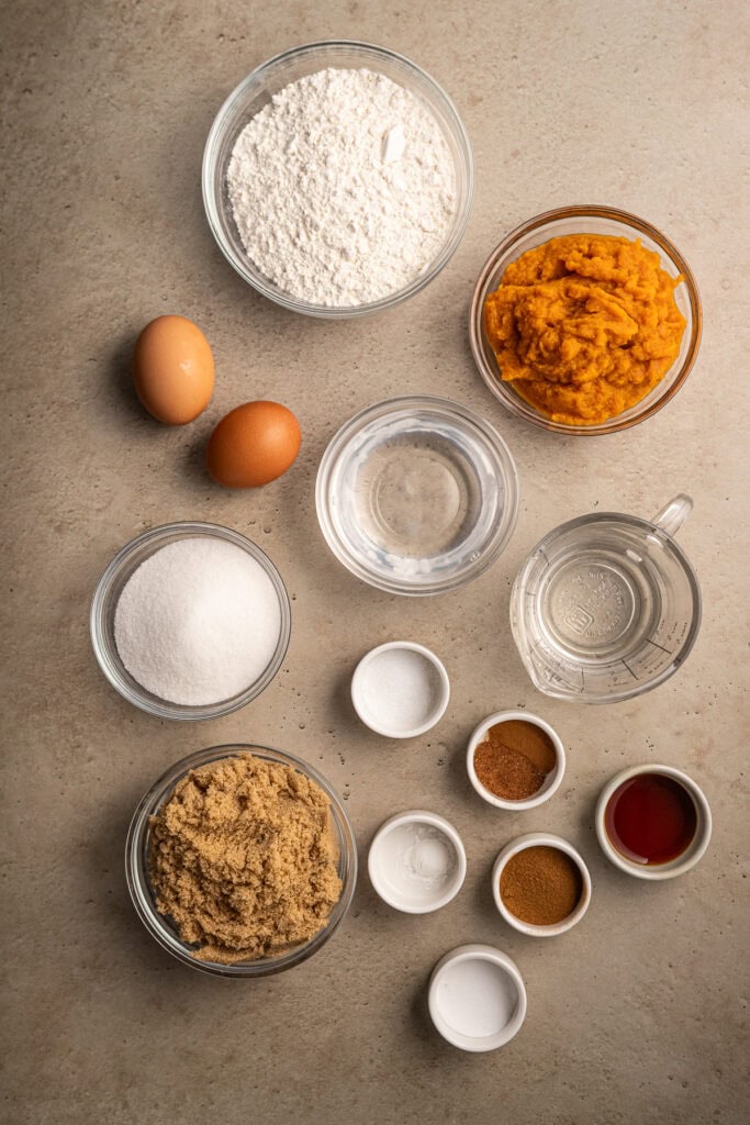 Sweet potato pie ingredients, including flour, sweet potato mash, eggs, sugar, spices, and liquid measurements, ready for baking. Perfect for dessert recipes from Stuck On Sweet.