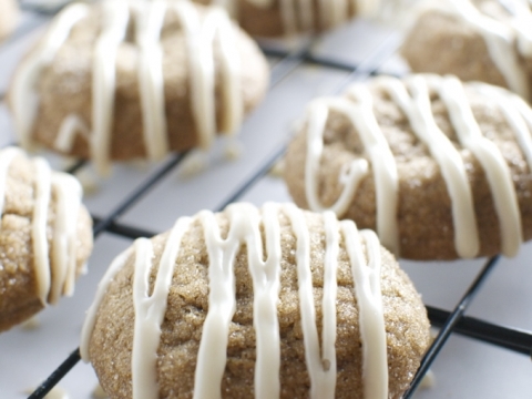 Chewy ginger molasses cookies drizzled with mocha glaze on a cooling rack, showcasing delicious homemade sweet treats for dessert recipes.