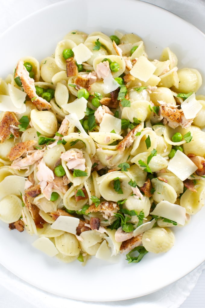 Creamy chicken and gnocchi pasta with peas, parmesan, and fresh herbs for comfort food and easy dinner recipes.