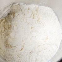 Flour mixture in a mixing bowl for baking, close-up.