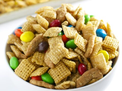 Caramel Chex Mix in a white bowl