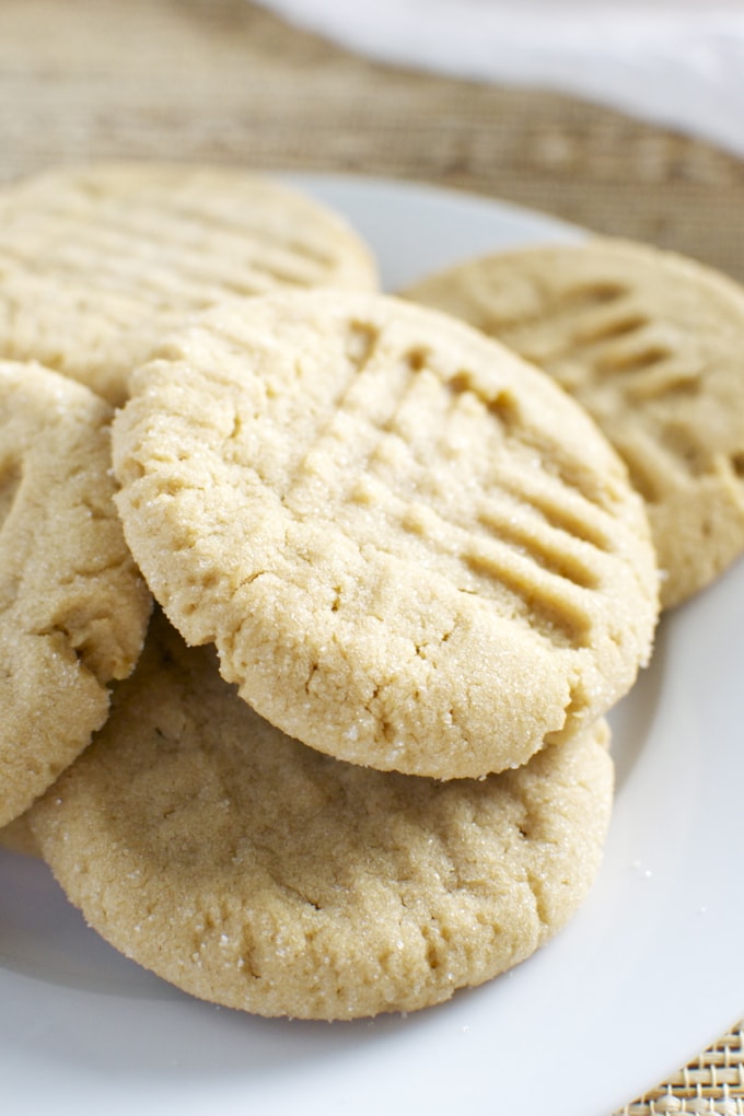 Butter cookies on a white plate, close-up of homemade cookie with ridges, soft and crumbly texture, perfect for baking and sweet treats, Stuck On Sweet bakery quality.