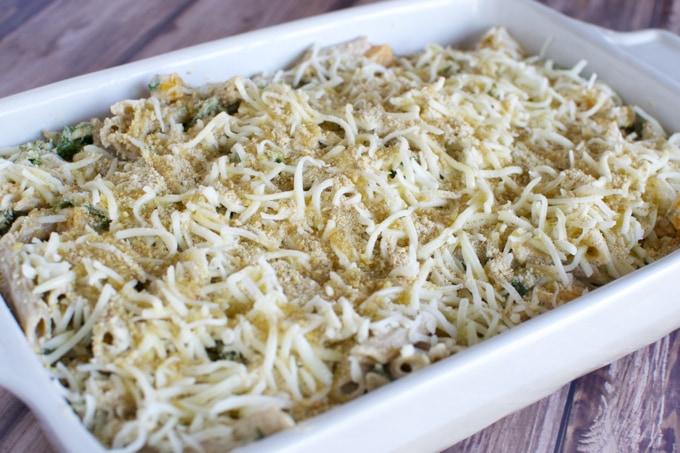 Creamy baked mac and cheese with melted cheese and breadcrumb topping in a white casserole dish. Perfect comfort food for family dinners or parties.
