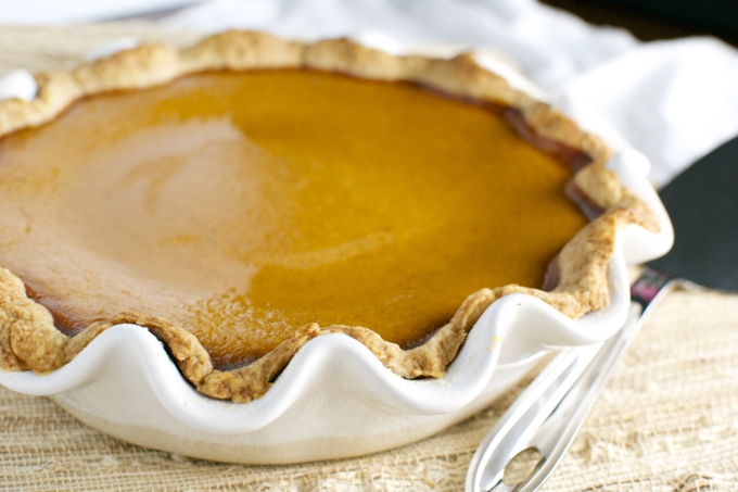 Creamy caramel pie in a decorative ceramic dish with a golden, smooth filling perfect for dessert lovers at Stuck On Sweet.