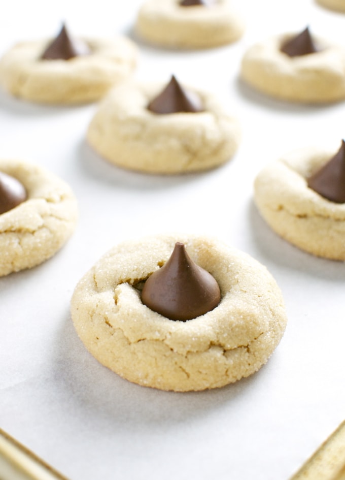 Peanut butter blossom cookies with a chocolate kiss in the center, classic and delicious shortbread cookies perfect for holidays and special occasions.