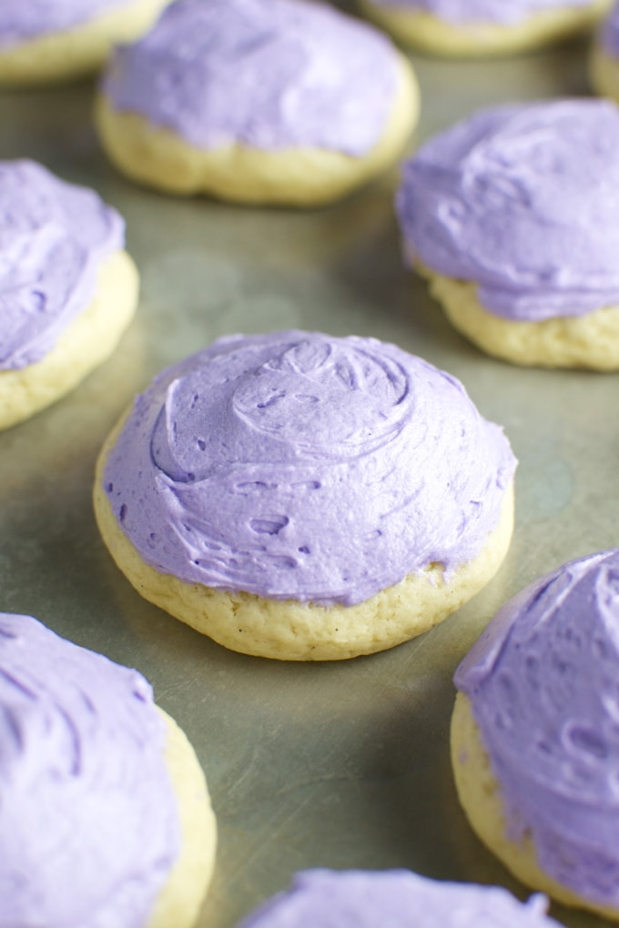 Delicious purple frosting topped sugar cookies, perfect for sweet treats and dessert decorating.