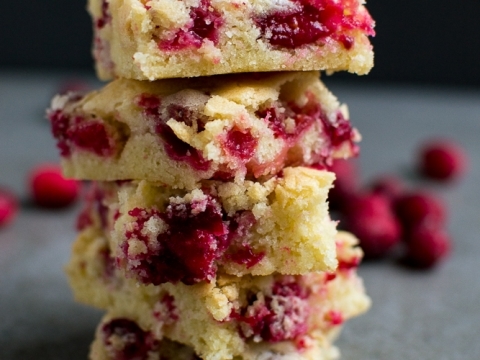 Delicious homemade raspberry crumb bars with a buttery crust and vibrant berry filling. Perfect for dessert or sweet snack, showcasing fresh berries and crumb topping.