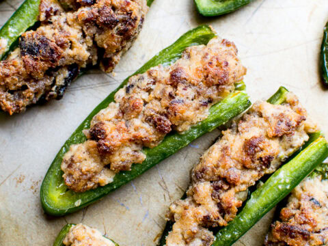 Cream Cheese Stuffed Jalapeño Poppers - Spicy, cheesy appetizers with crispy bacon, perfect for parties. Easy and delicious stuffed jalapeño peppers with cream cheese filling.