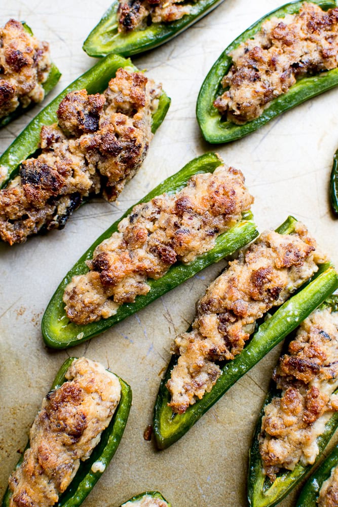 Cream Cheese Stuffed Jalapeño Poppers - Spicy, cheesy appetizers with crispy bacon, perfect for parties. Easy and delicious stuffed jalapeño peppers with cream cheese filling.