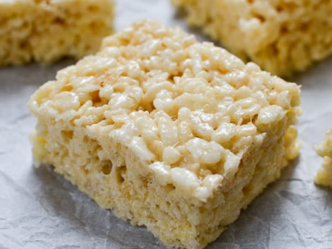 Rice Krispie Treat on parchment paper cut into square