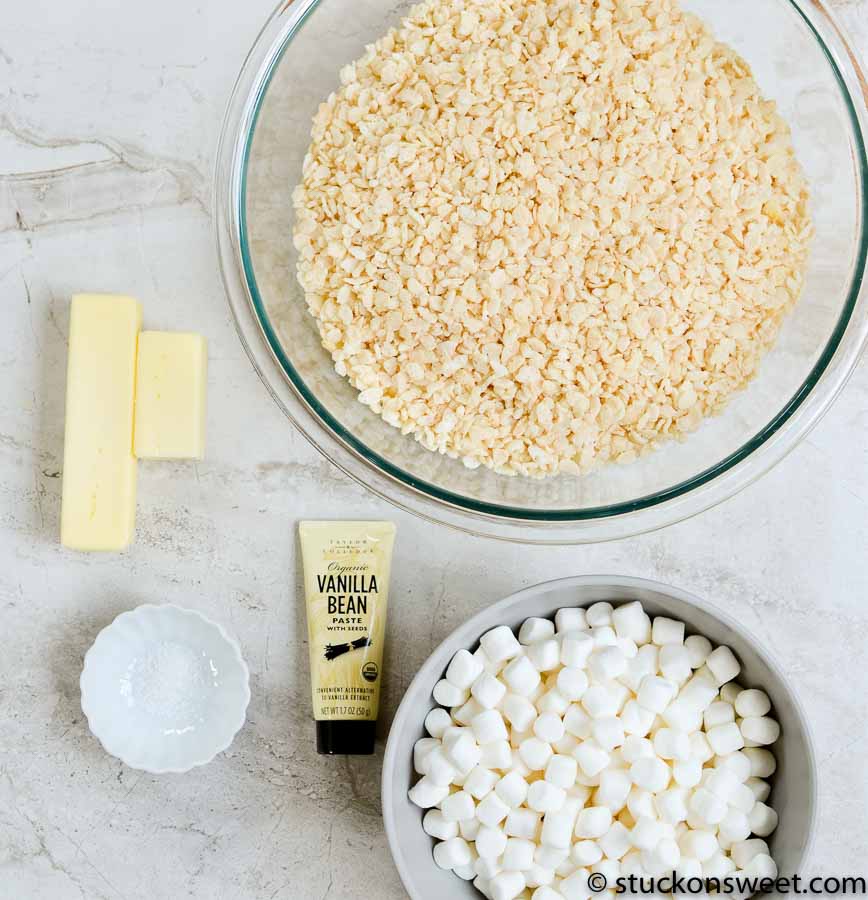 Flaked rice, marshmallows, vanilla bean paste, and butter ingredients for making sweet treats on Stuck On Sweet website.