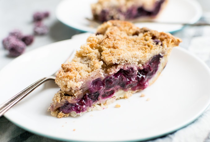 Fresh homemade blackberry crumble pie with golden crust and juicy berry filling, perfect for dessert lovers. Made with fresh blackberries, buttery crust, and sweet crumble topping.