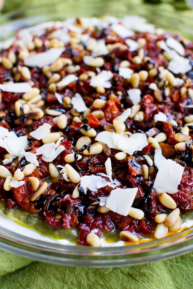 Hearty lasagna with melted cheese, rich tomato sauce, and fresh herbs in a clear glass baking dish. Perfect for family dinners or special occasions.
