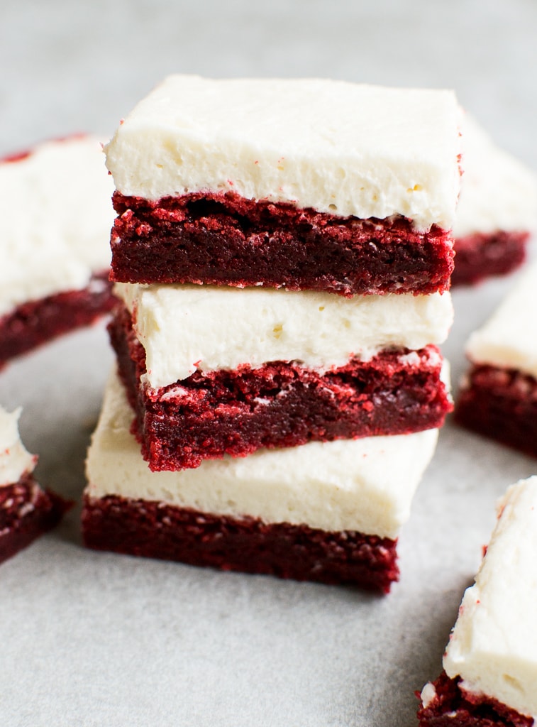 Rich red velvet cheesecake bars with cream cheese frosting, layered for a decadent dessert. Perfect for special occasions and sweet cravings.