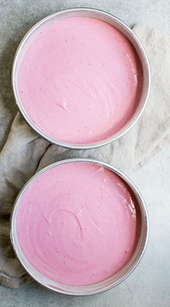 Pink strawberry ice cream in metal bowls, perfect for sweet treats and dessert recipes.