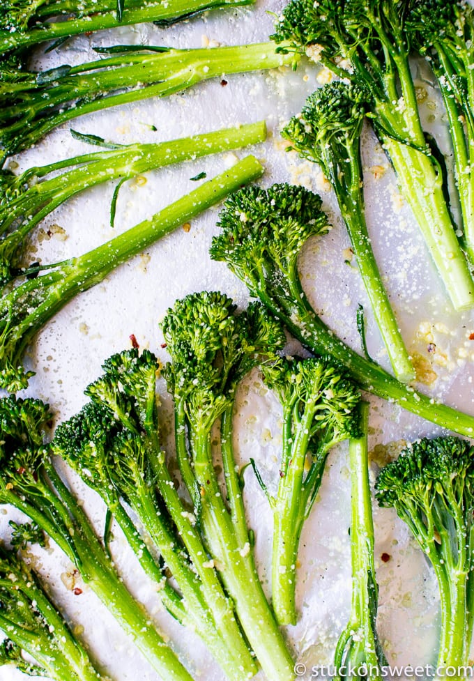 Fresh broccoli florets with seasoning; healthy vegetable ingredients for recipes.
