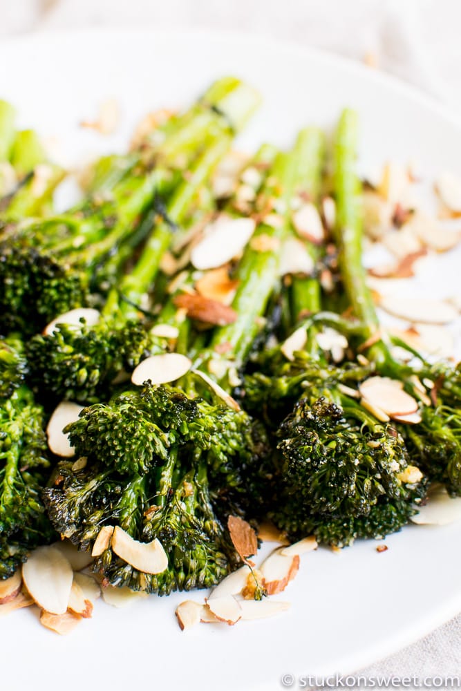 Roasted broccoli with sliced almonds and toasted garlic, healthy veggie side dish, nutritious plant-based recipe, easy roasted broccoli recipe.