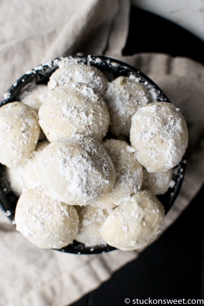Homemade snowball cookies dusted with powdered sugar, perfect for holiday treats and festive baking.