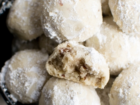 Snowball cookies topped with powdered sugar, perfect for holiday desserts and sweet treats. Easy to make and melt-in-your-mouth delicious.