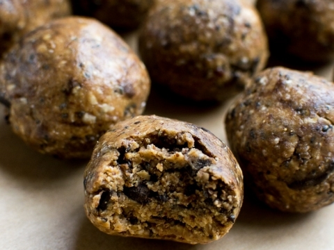 Peanut butter chocolate chip energy bites with a chewy texture and rich chocolate flavor. Perfect healthy snack or dessert option from Stuck On Sweet.