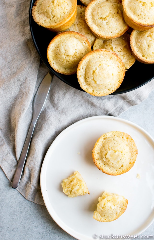 Fluffy vanilla cupcakes with golden crust, perfect for baking and dessert recipes. Harshly baked cupcakes served on a white plate with a crumb texture and soft interior.