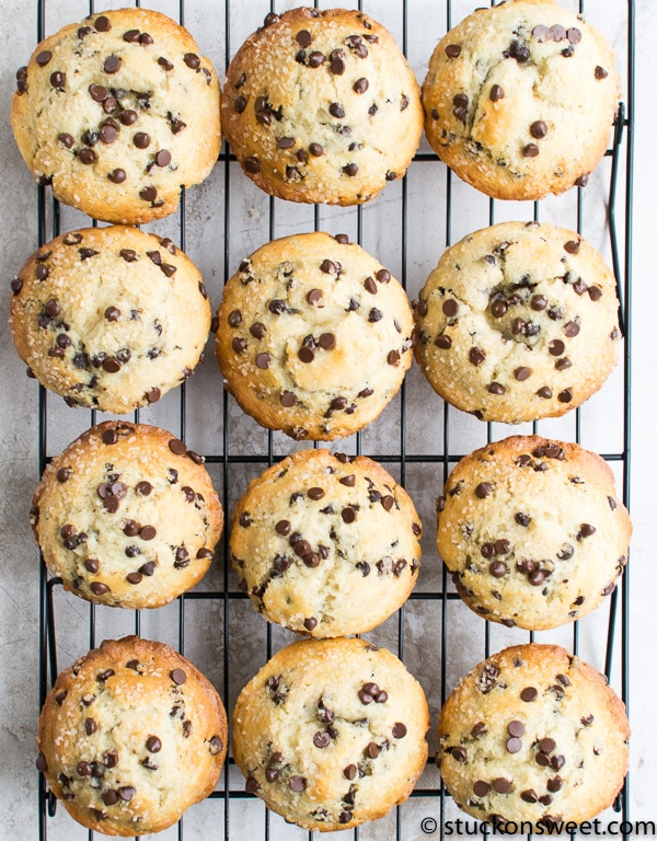Buttery chocolate chip cookies on cooling rack with golden edges and gooey chocolate chips.