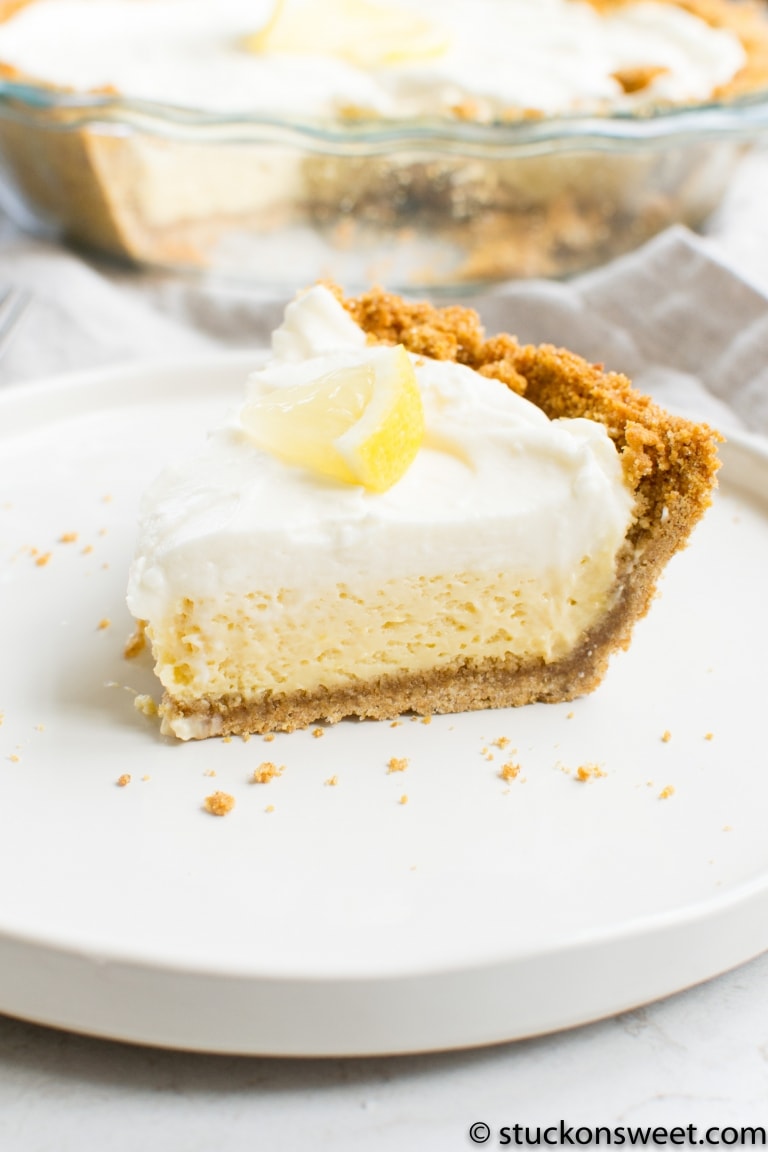Rich lemon cheesecake with graham cracker crust and creamy topping, perfect for dessert lovers and lemon flavor enthusiasts.