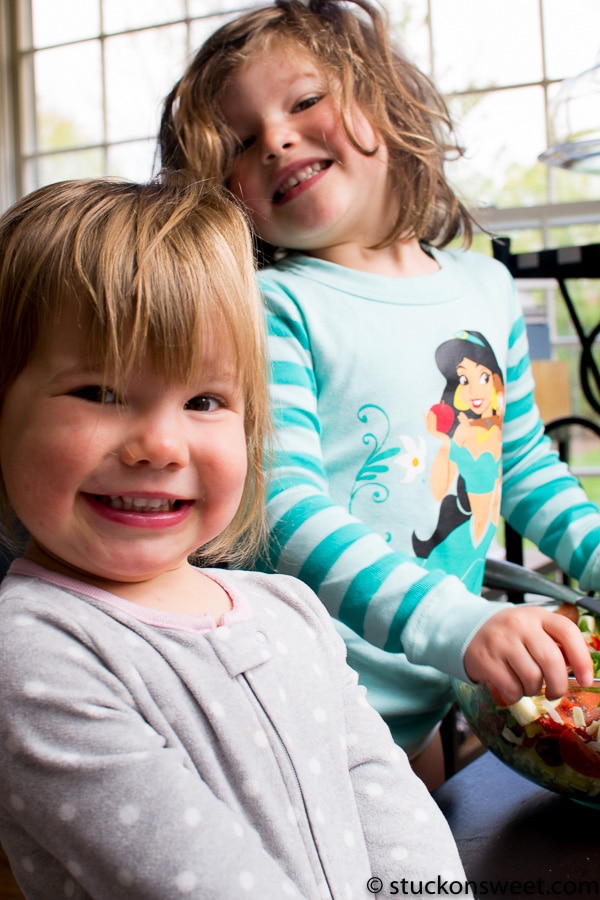 Bright smiling children enjoying colorful, fresh fruit snacks in a cozy home setting, highlighting healthy kids' snacks and fun food ideas for children.