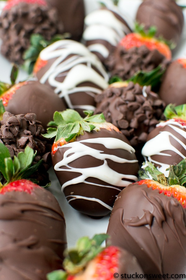 Rich chocolate-covered strawberries with white and dark chocolate drizzle, perfect for sweet treats and dessert lovers.