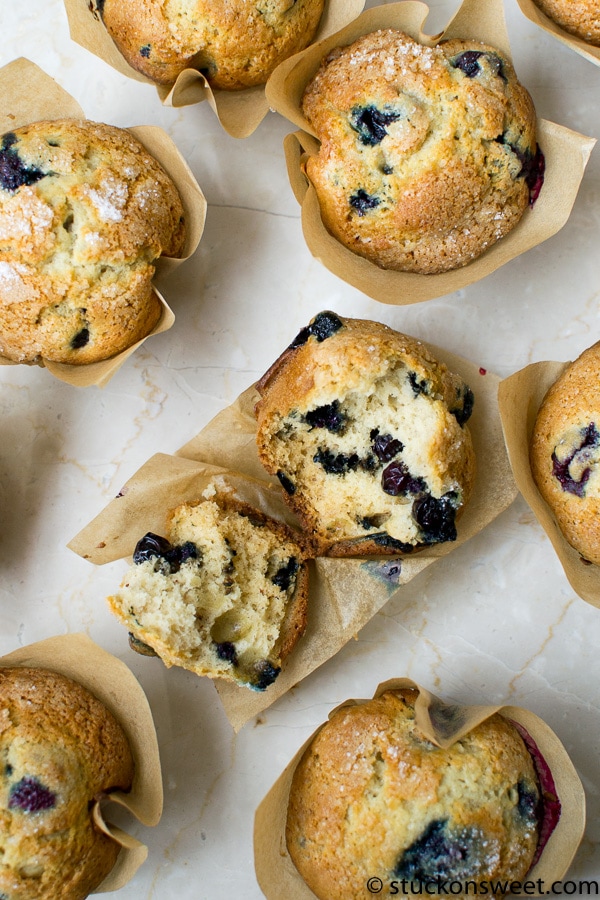 Fresh blueberry muffins with golden crust and moist interior, baked in paper liners, perfect for breakfast or snack. Made with fresh blueberries and natural ingredients.